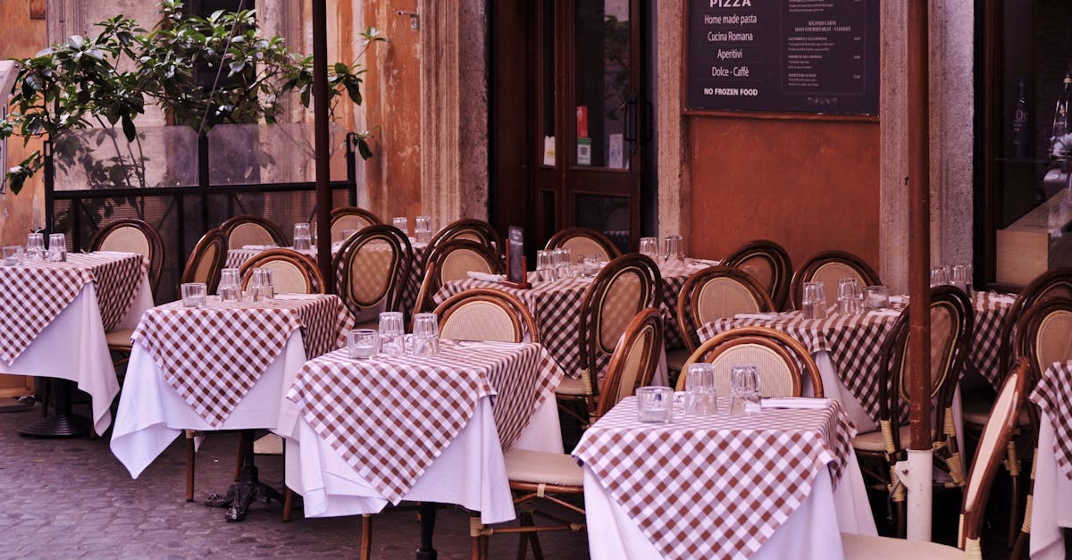 Cozy Italian restaurant with checkered tablecloths and inviting outdoor seating.
